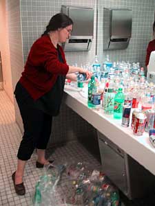 Rinsing bottles and cans.