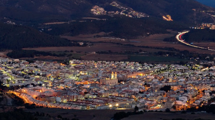 small Iberian city at dusk, viwed from a high point, nearby