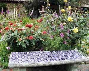 tiled bench in the garden of Mission San Juan Bautista